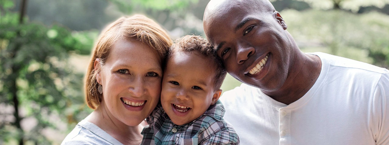 Mother Father and Son, multicultural family checking for eye disease.